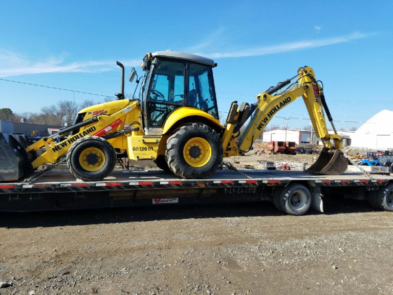 New Holland B95b backhoe fits on a step-deck trailer