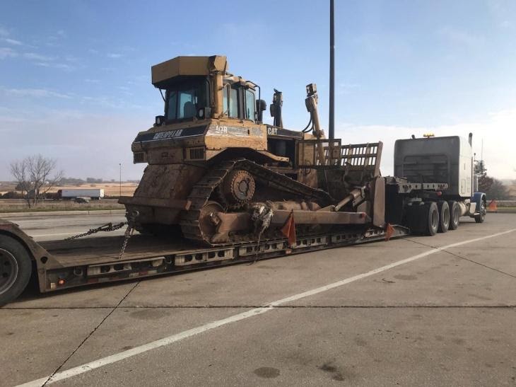 Oversize CAT Bulldozer being hauled