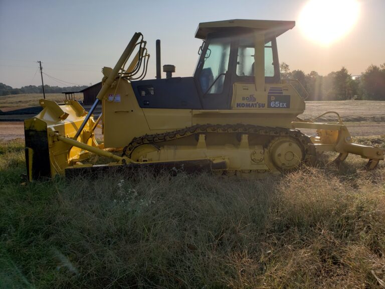 Komatsu 65EX Dozer in grass.