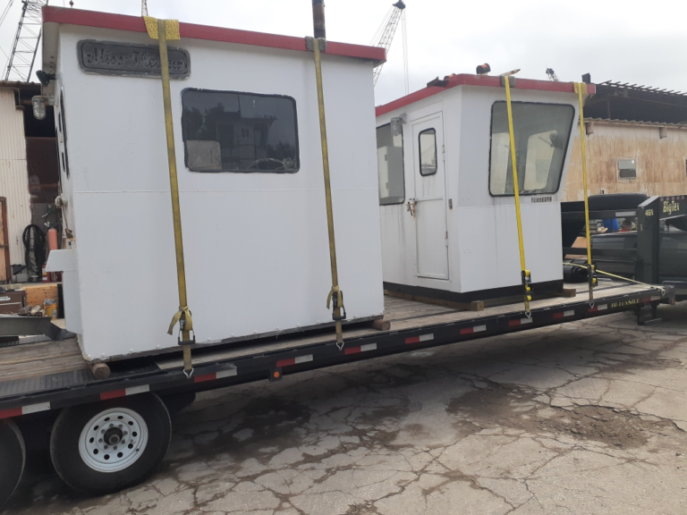 Hauling a tugboat on a trailer.