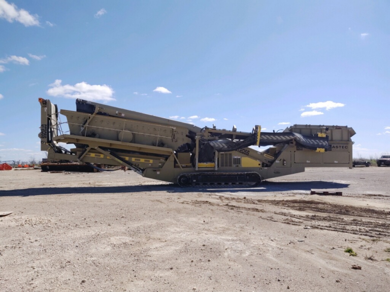 Hauling a JCI KPI GT 205 Mobile Screener on an extendable trailer.