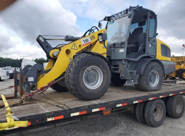 Transporting a construction equipment on a trailer.