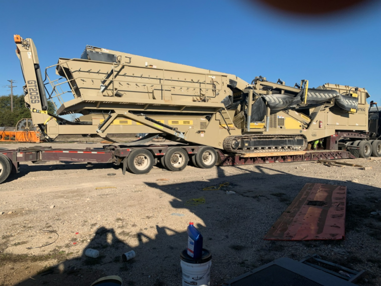 Hauling a JCI KPI GT 205 Mobile Screener on an extendable trailer.