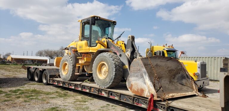 Romco Wheel Loader on a RGN trailer.