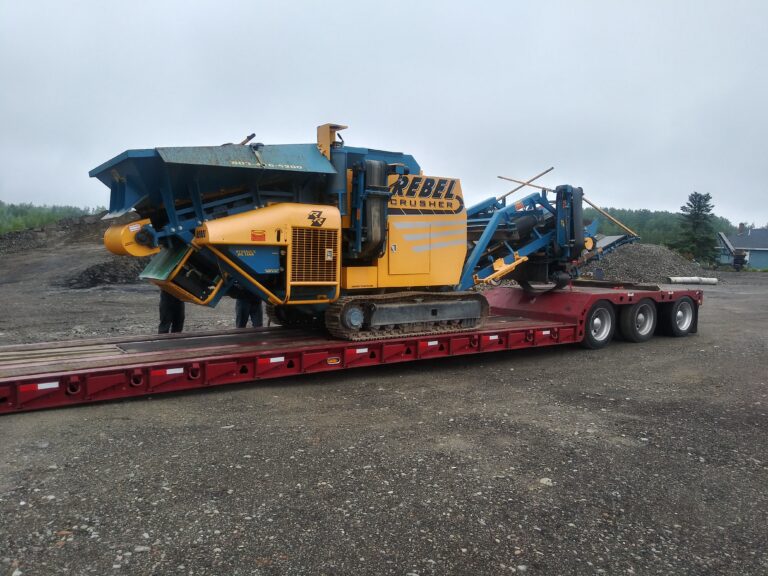 Rebel Crusher transported on a lowboy trailer.