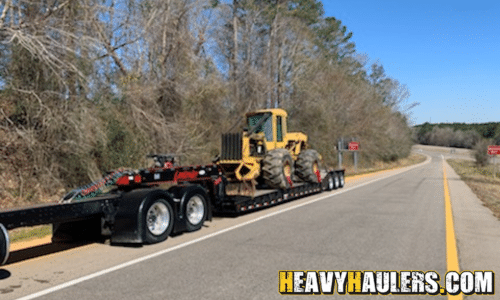 Hauling a Skidder.