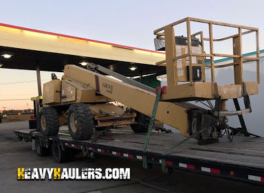 Boom Lift Loaded on a flatbed trailer