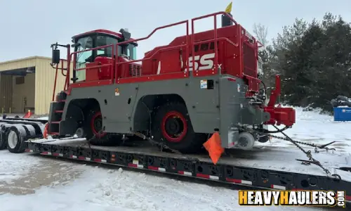 Shipping a Boss rail car on a lowboy trailer.