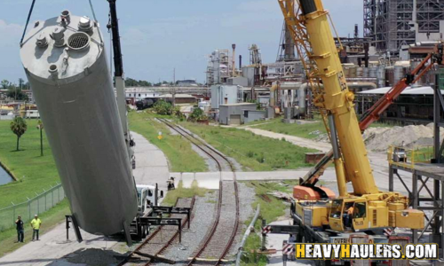 Crane lifting Silo.