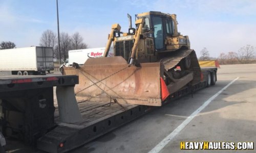 Caterpillar Tractor transported on a RGN trailer.