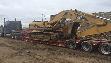 Hauling Caterpillar 316F Hydraulic Excavator