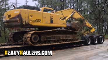 Hauling a Komatsu PC 300LC Hydraulic Excavator